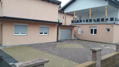 a parking lot in front of two buildings at KAĆA APARTMANI 1 in Banja Luka
