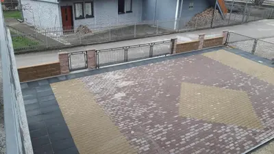 an overhead view of a tile floor with a fence at KAĆA APARTMANI 1 in Banja Luka