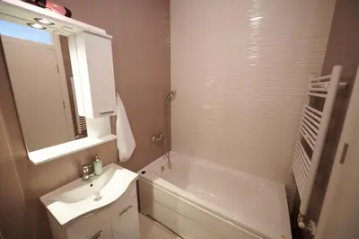 a bathroom with a sink and a tub and a toilet at Modern luxurious apartment in Banja Luka