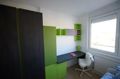 a room with a desk with a chair and a window at Modern luxurious apartment in Banja Luka
