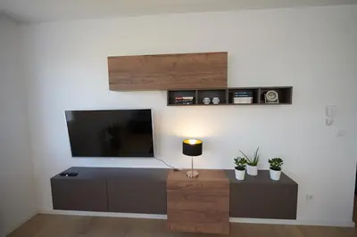 a living room with a flat screen tv on a wall at Modern luxurious apartment in Banja Luka