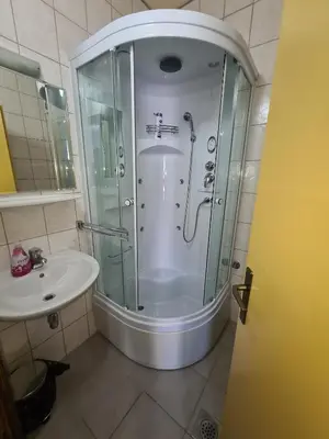 a bathroom with a shower and a sink at Apartments and Rooms Ski in Vlasic