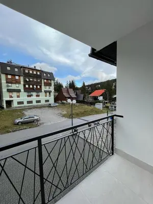 a balcony with a view of a parking lot at Apartments and Rooms Ski in Vlasic