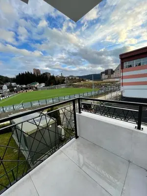 a balcony with a view of a soccer field at Apartments and Rooms Ski in Vlasic