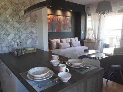a living room with a couch and a table at Apartman Diva in Tuzla