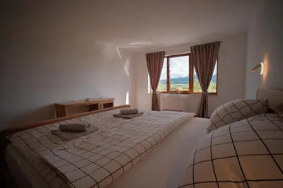 a bedroom with two beds and a window at Motel Vujeva in Livno