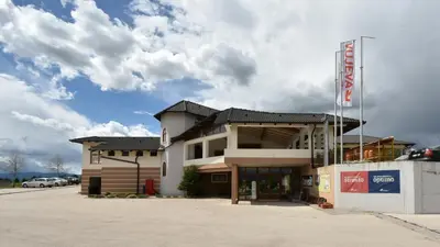 a building with a sign in front of it at Motel Vujeva in Livno