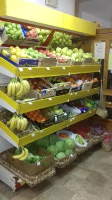 a produce section of a store filled with fruits and vegetables at Gradska Kavana Guest House in Kupres