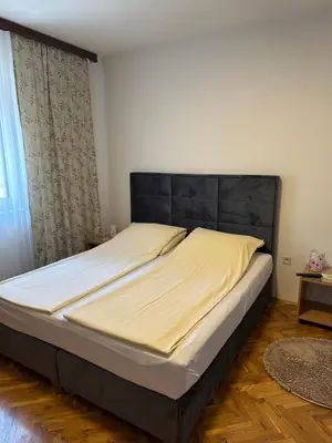 a bed in a bedroom with a large mattress at Una La Unica in Bihać