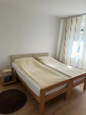 a bed in a room with a window at Una La Unica in Bihać