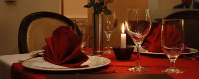a table with red napkins and wine glasses on it at Motel Restoran Gurman in Banja Luka