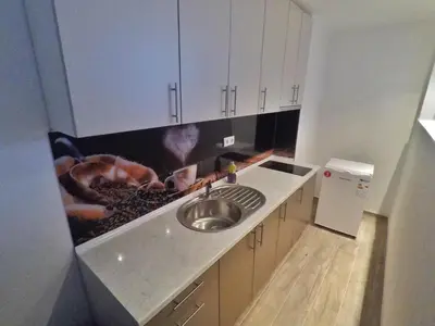 a kitchen with a sink and a counter top at Studio apartman Centar in Banja Luka
