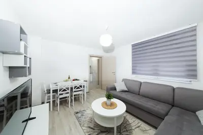 a living room with a couch and a table at Apartman Centar in Banja Luka
