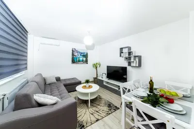 a living room with a couch and a table at Apartman Centar in Banja Luka