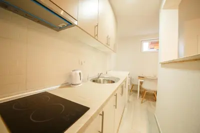 a kitchen with a sink and a counter top at Apartman Top Spot in Banja Luka