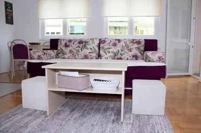 a living room with a couch and a table at Apartman Marija in Banja Luka