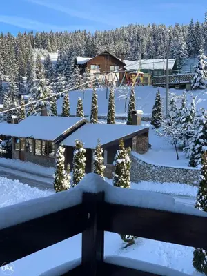 a house with christmas lights in the snow at MIMI 302 Eko Fis Vlasic in Vlasic