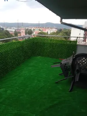 a green lawn on top of a building at Apartman Penthaus u strogom centru Banja Luke in Banja Luka