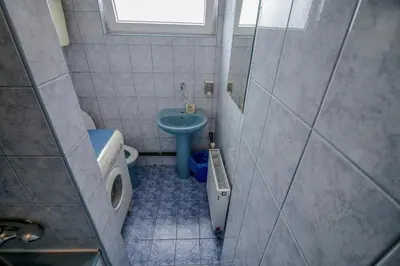 a small bathroom with a toilet and a sink at Apartman Penthaus u strogom centru Banja Luke in Banja Luka