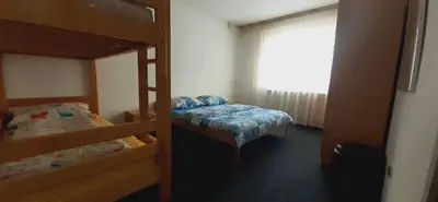 a bedroom with two bunk beds and a window at Vinara Kupres in Kupres