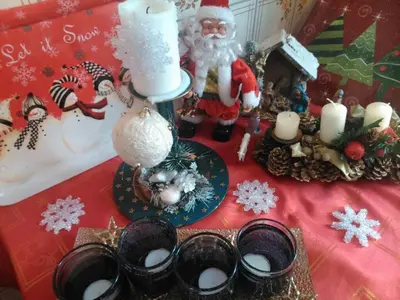 a table with christmas decorations and a santa on it at Vinara Kupres in Kupres
