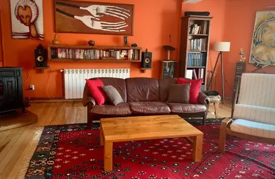 a living room with a couch and a coffee table at Kula hacienda in Tuzla