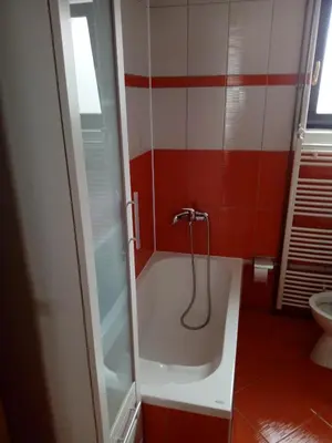 a bathroom with a bath tub with a shower at Apartman Nadija in Jajce