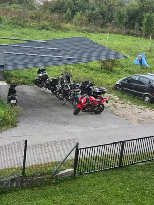 a bunch of motorcycles parked under a parking lot at Apartman Nadija in Jajce