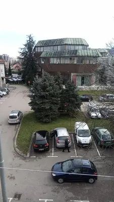 a group of cars parked in a parking lot at Stan na dan Banja Luka in Banja Luka