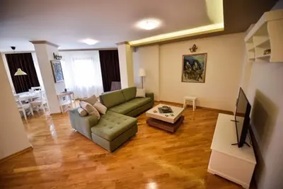 a living room with a couch and a table at Apartman Natalija Banja Luka in Banja Luka