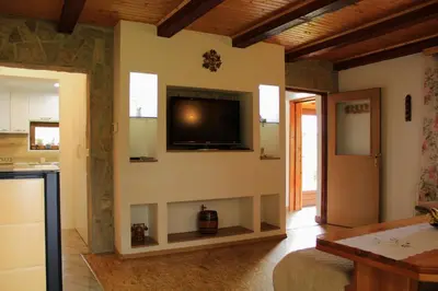 a living room with a flat screen tv on the wall at 