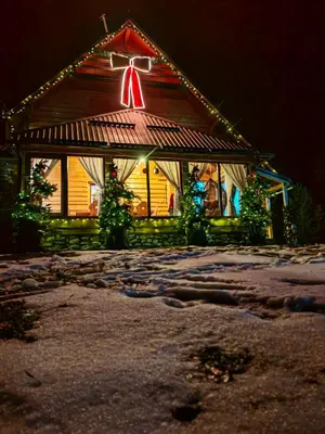 a house with a christmas light on the roof at 