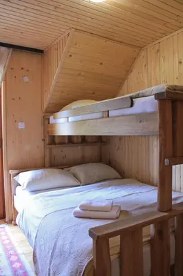 a bedroom with two bunk beds in a cabin at 