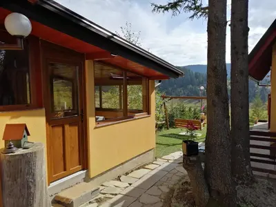 a house with a view of the mountains at Apartmani ( VILA ) Vucko in Vlasic