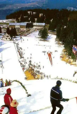 a group of people standing on a ski slope at Apartmani ( VILA ) Vucko in Vlasic