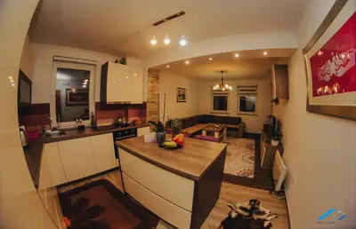 a kitchen and living room with a counter top at Brilliant Apartman in Bihać