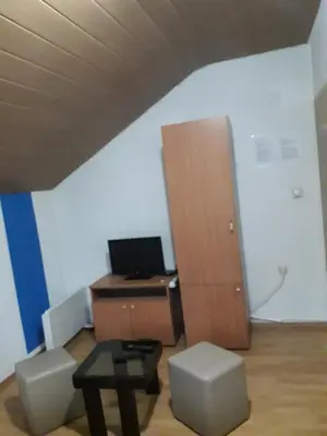an office with a desk with a computer and a cabinet at Hostel Topić in Banja Luka