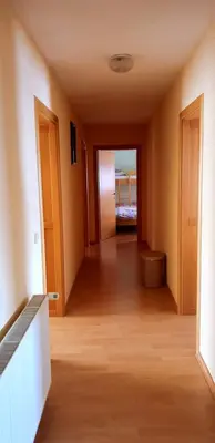 an empty hallway with a hallway leading to a room at Jelena in Kupres