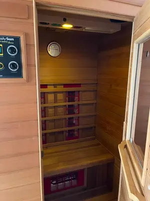 a small sauna with a clock on the wall at Vacation Home Pliva in Šipovo