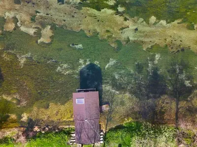 an aerial view of a small building in a field at Vacation Home Pliva in Šipovo