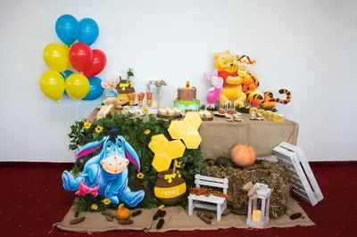 a table with a display of toys and balloons at Hotel CITY in Prnjavor
