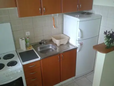a small kitchen with a sink and a refrigerator at Apartment 3M in Banja Luka