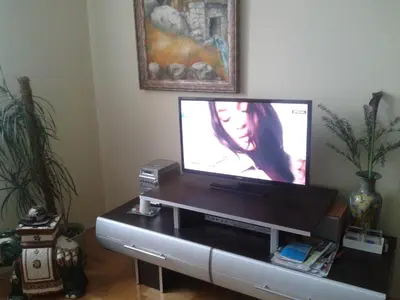 a flat screen tv sitting on top of a table at Apartment 3M in Banja Luka