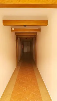 an empty hallway in a room with a wood ceiling at Vlašićka priča Eko Fis in Vlasic