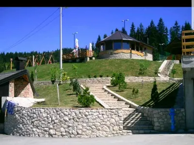 a house on top of a hill with stairs at Vlašićka priča Eko Fis in Vlasic