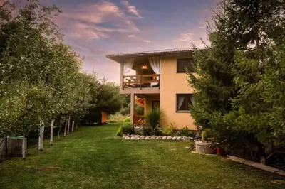 a house with a lawn in front of it at Eden Visoko in Visoko