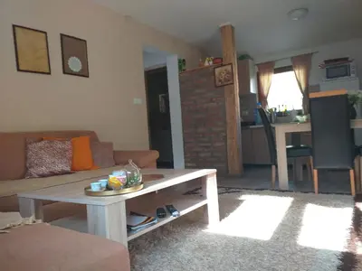 a living room with a couch and a table at Eden Visoko in Visoko