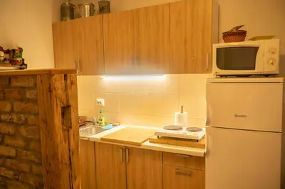 a kitchen with a white refrigerator and a microwave at Eden Visoko in Visoko