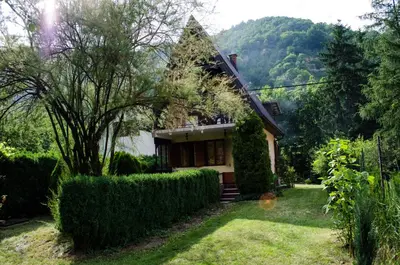 a house in the middle of a yard at Tammaris Holiday Home in Visoko
