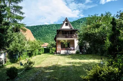 a house in the middle of a yard at Tammaris Holiday Home in Visoko